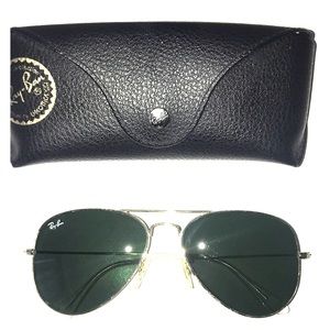 Ray- Bans: Classic Gold Aviators with grey lenses.